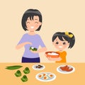 Mother and daughter make zongzi together.