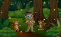 Cartoon the safari boy and monkeys in the jungle Royalty Free Stock Photo