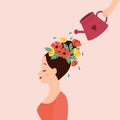 Personal development metaphor. Hand watering a woman head decorated with flower.