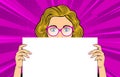 Pop art blonde woman. Woman with blue eyes in glasses holding white paper. Royalty Free Stock Photo