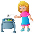 Young girl throwing garbage in trash bin