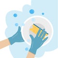 Hands in a rubber glove washes a plate Royalty Free Stock Photo