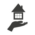 Hand holding house, vector icon silhouette, isolated on white Royalty Free Stock Photo