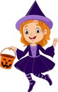 Cartoon girl wearing halloween witch costume holding pumpkin bucket Royalty Free Stock Photo