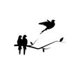 Flying birds silhouette on a branch and flying bird Royalty Free Stock Photo