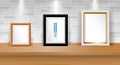 Printset of realistic blank photo frame on table or blank picture frame with down light or mock up frame poster exhibition