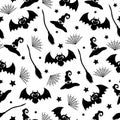 Witch hat, bat, spider web, and broom hand drawn seamless pattern in doodle style on white background for Halloween Royalty Free Stock Photo