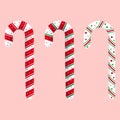 Christmas candy cane with red, green, and white color strip and stars design on a pink background. Set of three Christmas candies. Royalty Free Stock Photo