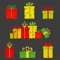 Set of multicoloured gift boxes isolated on dark background. Royalty Free Stock Photo