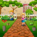 Gardener boy and girl caring for plants in the garden