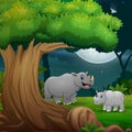 Night forest with a mother rhino and her cub Royalty Free Stock Photo