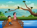 Happy children playing guitar and singing on a bridge Royalty Free Stock Photo