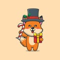 Cute fox holding christmas candy and gift Royalty Free Stock Photo