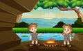 The explorer boy and girl lit a bonfire in the cave