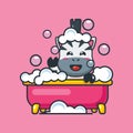 Cute zebra taking bubble bath in bathtub