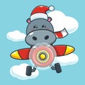 Cute hippo wearing santa hat fly with plane Royalty Free Stock Photo