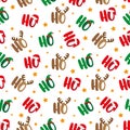 Ho Ho Ho seamless pattern with santa`s hat, deer antler, and elf hat. Islolated on white background. Royalty Free Stock Photo