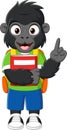 Cartoon happy gorilla with backpack and book pointing up