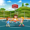 Three girls playing jump rope in the field Royalty Free Stock Photo