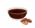 Date syrup in glass bowl with dried date fruits