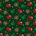 Ho Ho Ho seamless pattern with santa`s hat, deer antler, and elf hat. Islolated on green background. Royalty Free Stock Photo