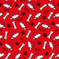 Dog paw seamless pattern for Christmas - paw print, and Santas hat, bone and woof text on red backgound. Royalty Free Stock Photo