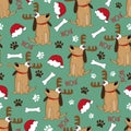 Dog seamless pattern for Christmas - santa hat, bone, paw print and cute dog in antler. Royalty Free Stock Photo