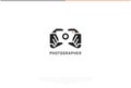 Photographer Logo Design. Vector Logo Template. A smart logomark of two hands holding a DSLR camera in a negative effect. A symbol Royalty Free Stock Photo