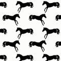 Black and white vector pattern with silhouettes of horses. Royalty Free Stock Photo