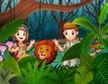 Zookeeper boy and girl with a lion in the jungle Royalty Free Stock Photo