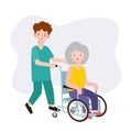 Nurse man on a walk with disabled grandmother in a wheelchair. Caring for elderly. Old woman Patient. Medicine staff. Healthcare Royalty Free Stock Photo