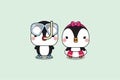 Cute little penguins couple holding safety buoy and wearing diving gear