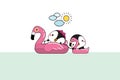 Relaxing cute penguins couple floating in flamingo and swan inflatable swimming pool toy on sea shore at sunny summer day Royalty Free Stock Photo