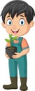 Cute little gardener holding plants in pot