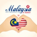 Malaysia National Day - Two hands making heart shape gesture with Malaysia flag. Royalty Free Stock Photo