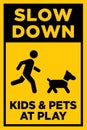 Slow Down - Kids and Pets at Play Sign | Child Safety Sign for Neighborhoods | Caution Signage for Residential Roads Royalty Free Stock Photo