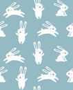 Print. Seamless Christmas background with rabbits. Blue Christmas pattern.