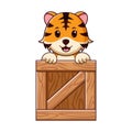 Cute Tiger in a wooden box Cartoon. Animal Icon Concept. Flat Cartoon Style. Suitable for Web Landing Page, Banner, Flyer, Sticker Royalty Free Stock Photo