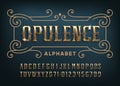 Opulence alphabet font. Gold letters and numbers with gemstones.