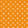 Mid century modern atomic starbursts seamless pattern on orange background.