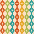 Mid century modern atomic starbursts over colorful ogee ovals seamless pattern in green, teal, orange and mustard yellow.