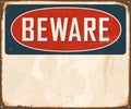 Vintage Beware metal sign with room for text or graphics. Royalty Free Stock Photo