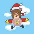 Cute bear wearing santa hat fly with plane. Royalty Free Stock Photo