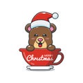 Cute bear wearing santa hat in cup. Royalty Free Stock Photo