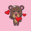 Cute bear cartoon character holding love heart in valentines day. Royalty Free Stock Photo