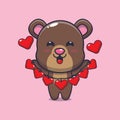 Cute bear cartoon character holding love decoration. Royalty Free Stock Photo