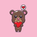 Cute bear cartoon character holding love heart. Royalty Free Stock Photo