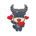 Cute buffalo cartoon character holding love heart in valentines day. Royalty Free Stock Photo