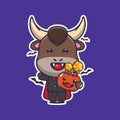 Vampire bull holding halloween pumpkin