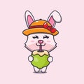 Cute bunny cartoon mascot character drink fresh coconut.